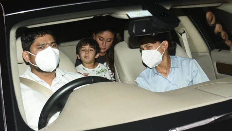 kareena kapoor spotted in untidy hair wearing shirt and striped pants outside home