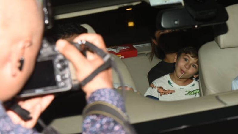 kareena kapoor spotted in untidy hair wearing shirt and striped pants outside home