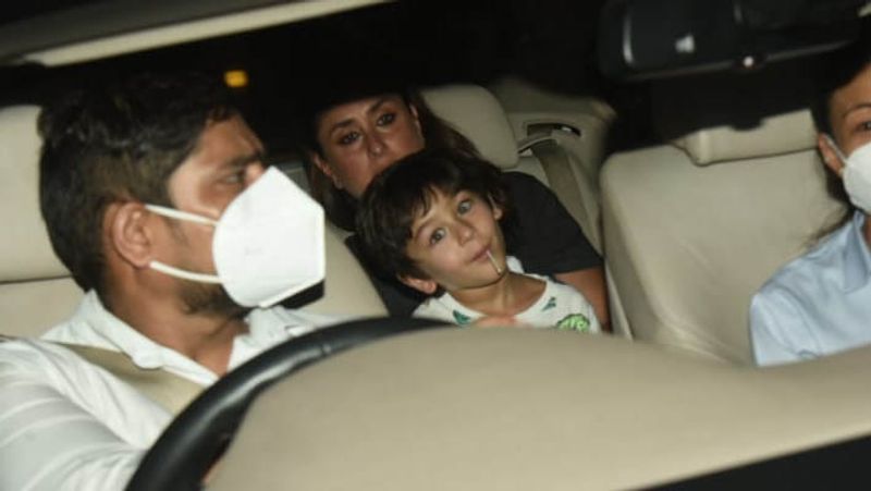 kareena kapoor spotted in untidy hair wearing shirt and striped pants outside home