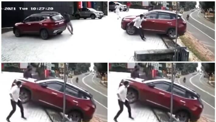 SUV rolls-down-dealership Showroom viral video SUV rolls-down-dealership Showroom viral video