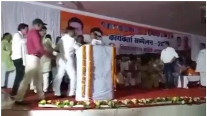 congress leaders pushed another leader on stage in chhattisgarh congress leaders pushed another leader on stage in chhattisgarh