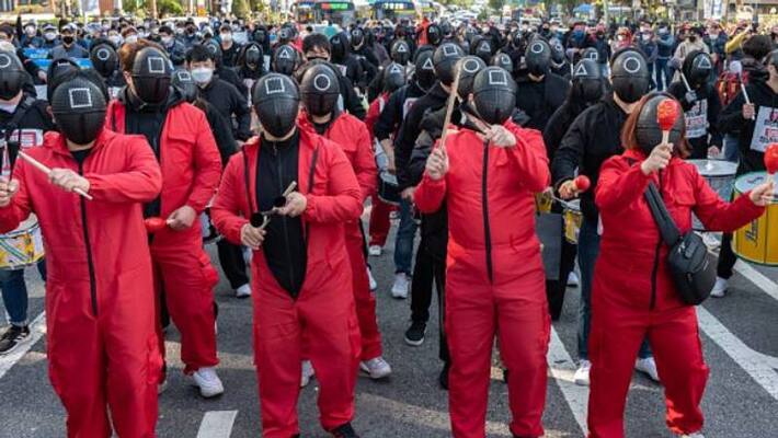 workers protest in South Korea with Squid Game costume workers protest in South Korea with Squid Game costume