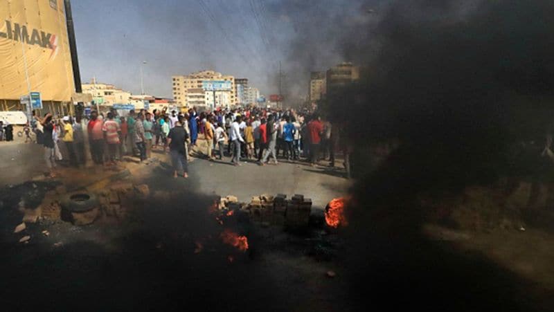 Sudan coup PM under house arrest internet and phone services were cut streets protest