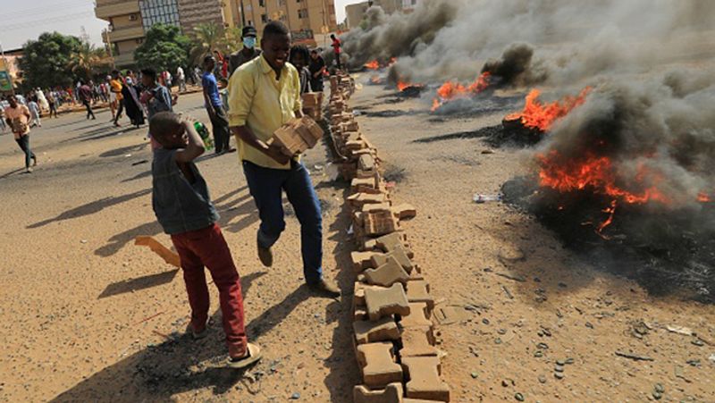 Sudan coup PM under house arrest internet and phone services were cut streets protest