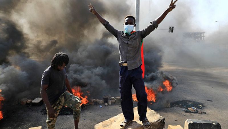Sudan coup PM under house arrest internet and phone services were cut streets protest