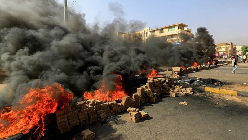 Sudan coup PM under house arrest internet and phone services were cut streets protest