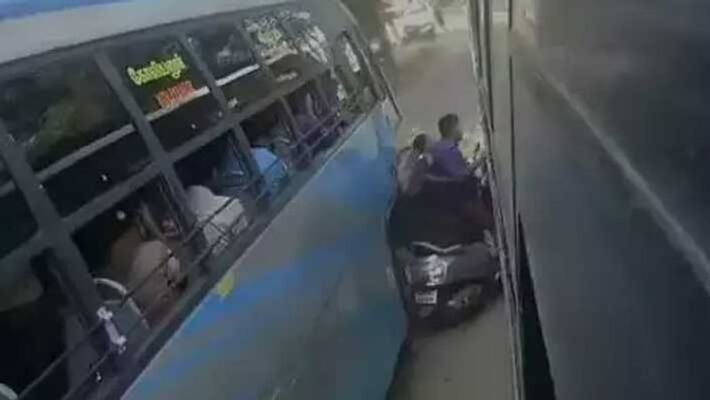 couple with infant trapped between 2 buses...shocking cctv footage couple with infant trapped between 2 buses...shocking cctv footage