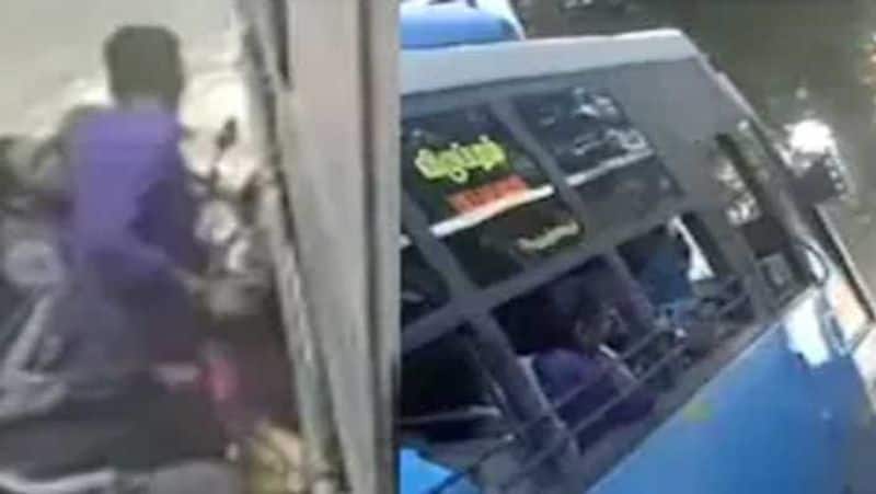 couple with infant trapped between 2 buses...shocking cctv footage