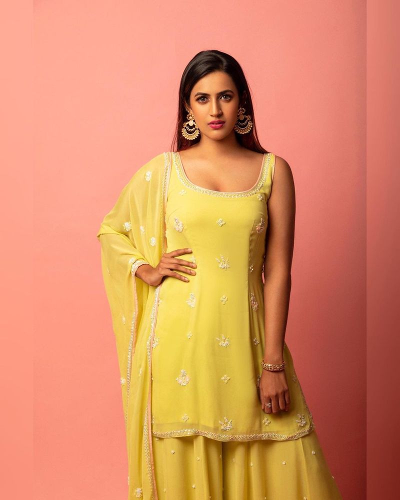 mega daughter niharika kondiela looks super stylish in yellow designer wear
