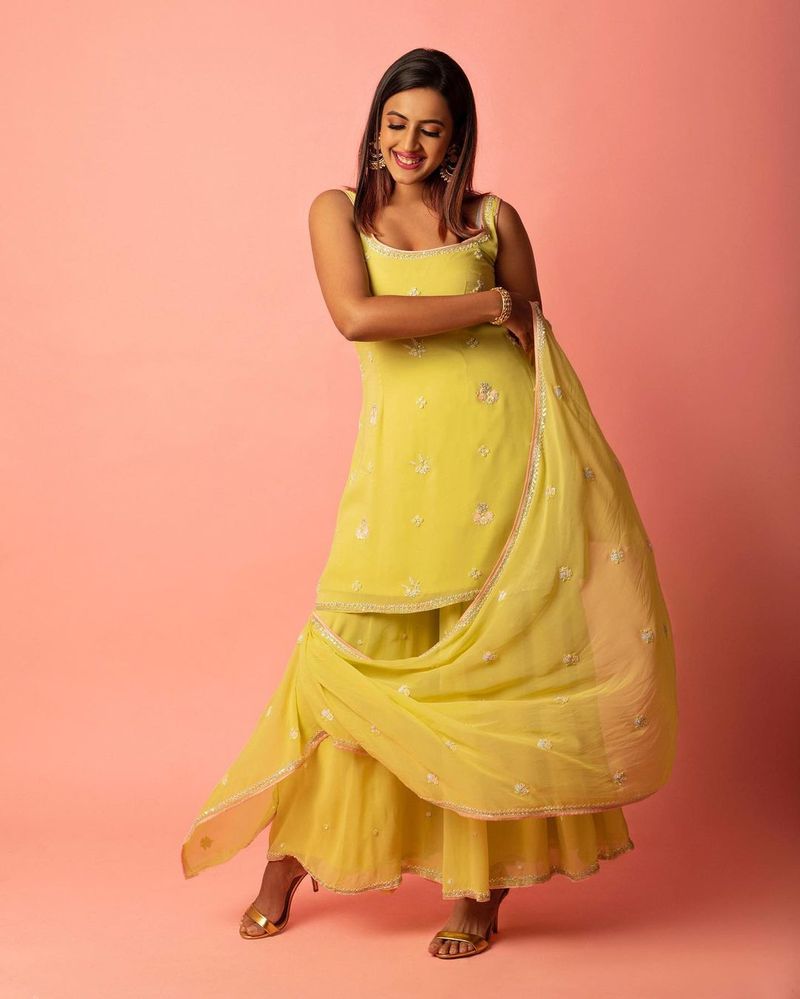 mega daughter niharika kondiela looks super stylish in yellow designer wear