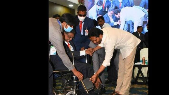 CM Jagan helps scholar off wheelchair, video goes viral on social media CM Jagan helps scholar off wheelchair, video goes viral on social media