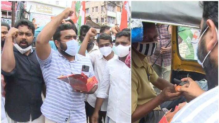 Fuel Price Cut youth congress sweet distribution in kottayam and vyttila Fuel Price Cut youth congress sweet distribution in kottayam and vyttila