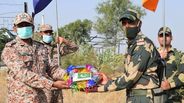 diwali 2021, border security force exchanges sweets with pakistani rangers at attari wagah border diwali 2021, border security force exchanges sweets with pakistani rangers at attari wagah border