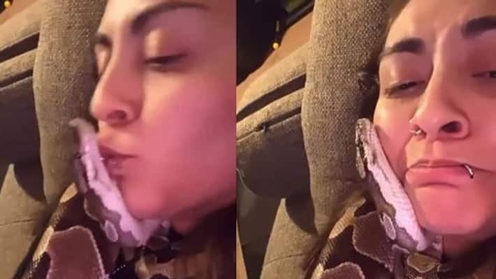 Girl cuddles and kisses pet snake in viral video Girl cuddles and kisses pet snake in viral video