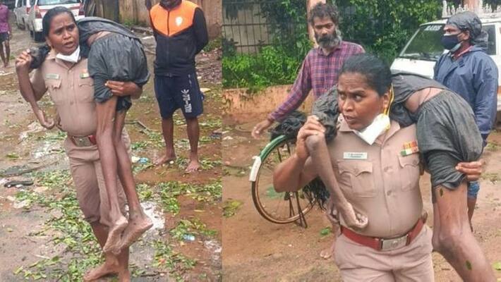 Woman police inspector carries unconscious man on her shoulders amid Chennai rain Woman police inspector carries unconscious man on her shoulders amid Chennai rain