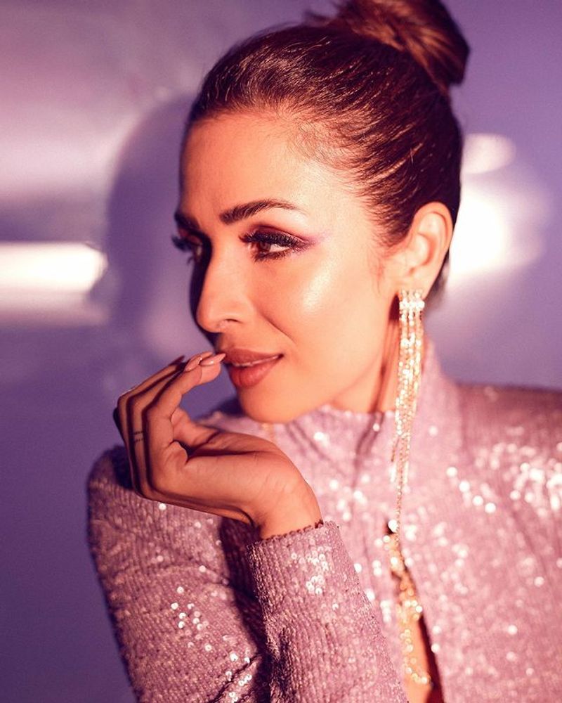 Malaika Arora skin tight purple dress photos shoot is stunning