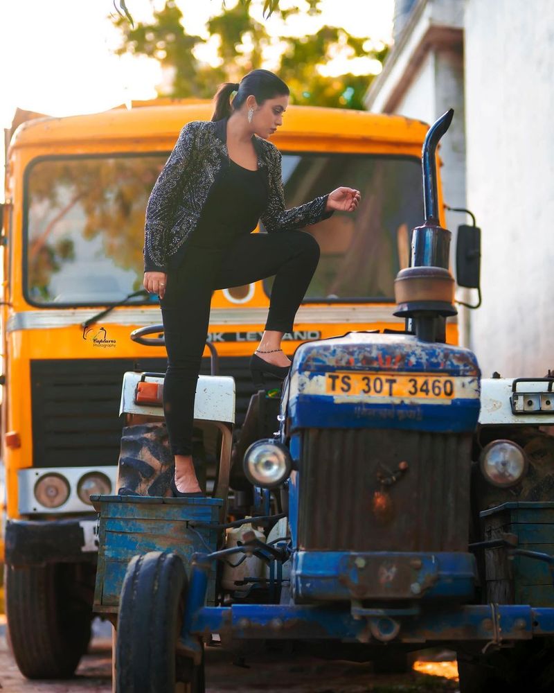 heorin poorna rises heat wears tight pants and coats