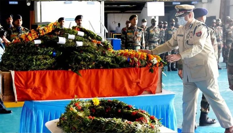 assam rifles attack martyr suman swargiarys last rites by wife and 3 year old son in manipur