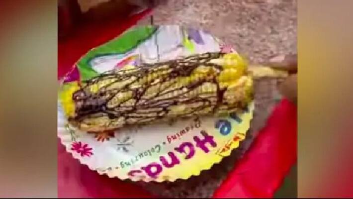 street vendor prepared chocolate masala sweet corn street vendor prepared chocolate masala sweet corn
