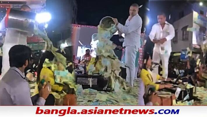 Gujarati folk singer showered with bucketful of cash during show in viral video. Internet reacts ALB Gujarati folk singer showered with bucketful of cash during show in viral video. Internet reacts ALB