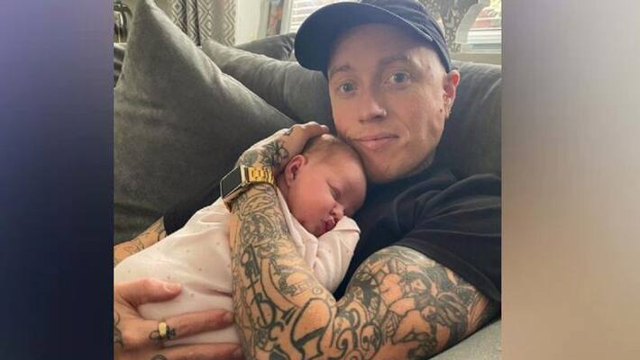 people confused whether the cake baker holds his own child or a cake people confused whether the cake baker holds his own child or a cake