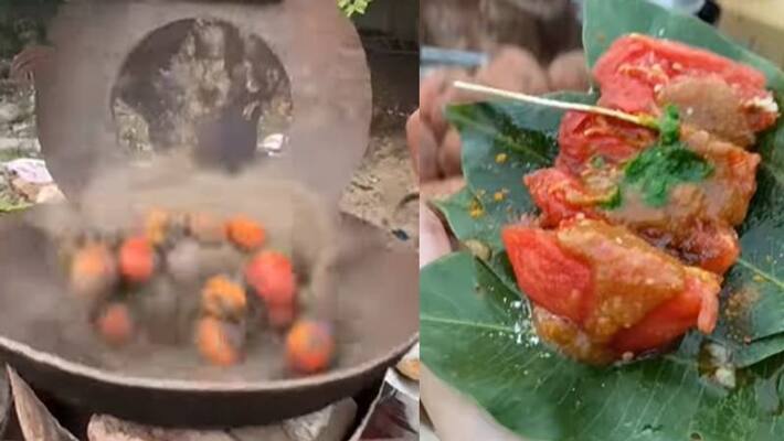 street food vendor roasts tomato in hot sand street food vendor roasts tomato in hot sand