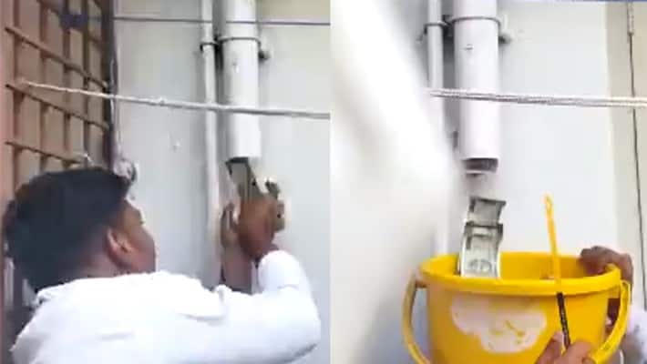 Money spills out of pipe during Anti Corruption Bureau raid Money spills out of pipe during Anti Corruption Bureau raid
