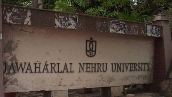 Delhi Police remove saffron flag, posters put up by Hindu Sena near JNU campus in swift action-dnm Delhi Police remove saffron flag, posters put up by Hindu Sena near JNU campus in swift action-dnm