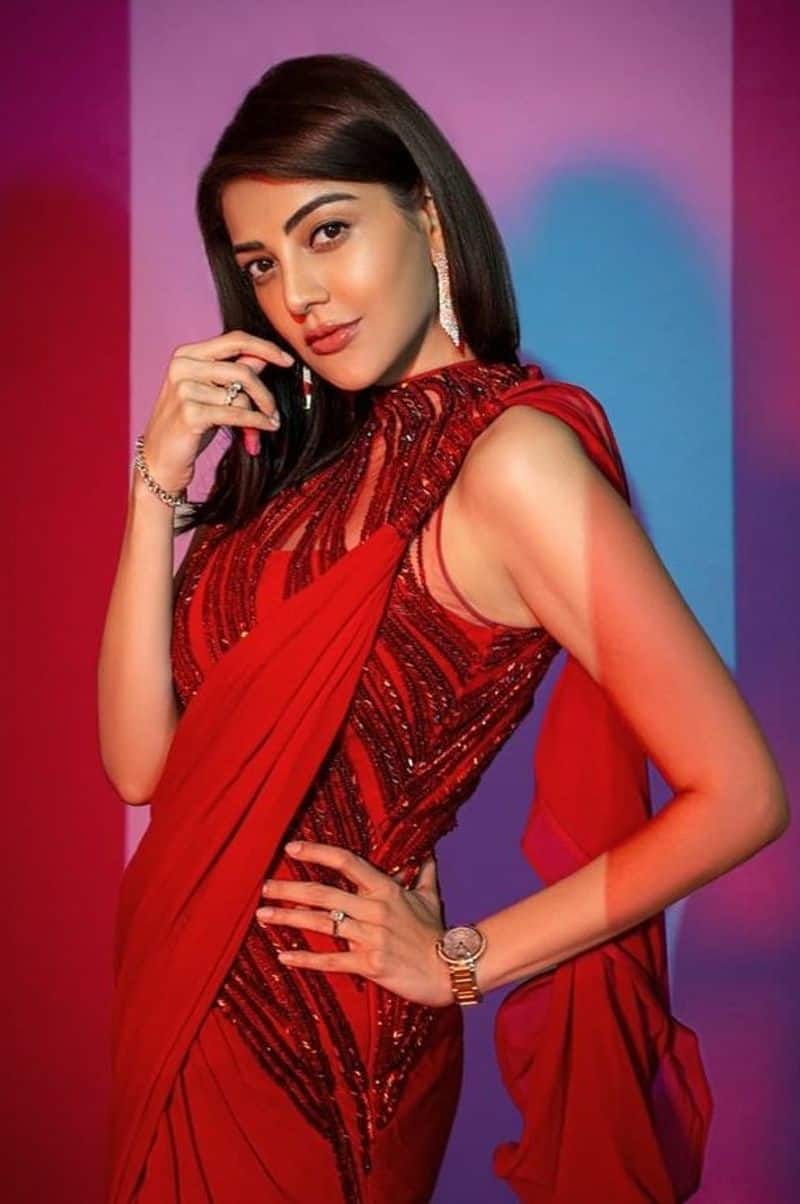 kajal blast with her hot look in red pre draped saree photos trending