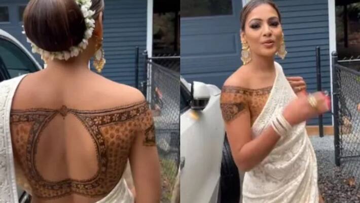 Video of woman wearing henna blouse with saree goes viral Video of woman wearing henna blouse with saree goes viral