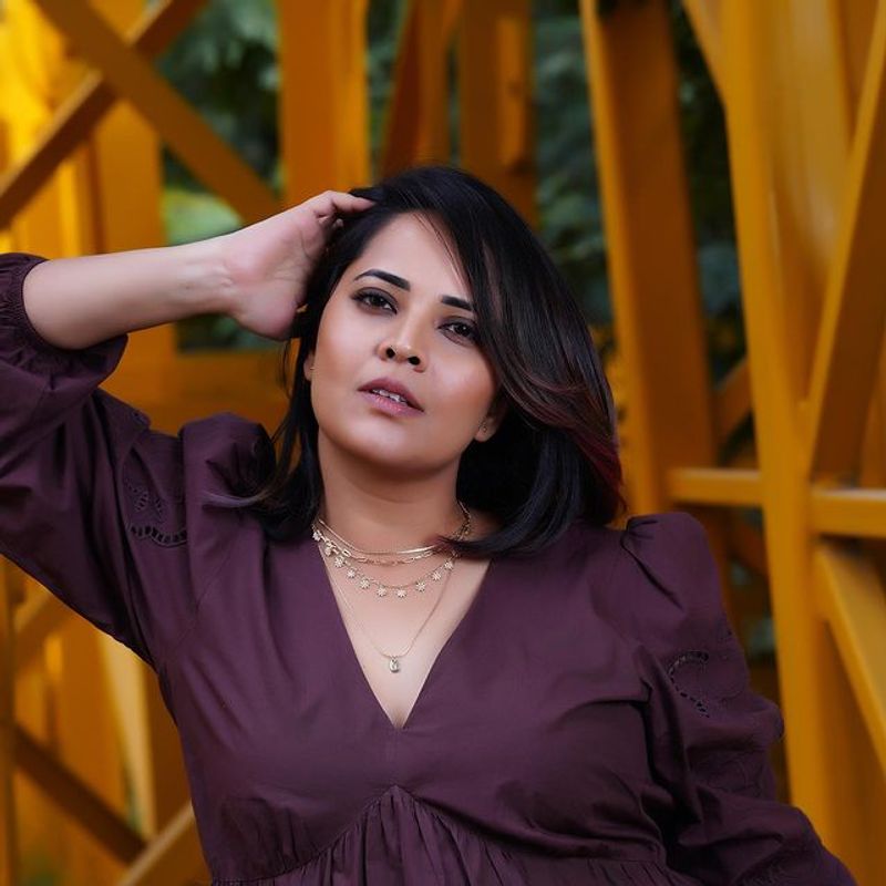 Anchor Anasuya stunning hot poses in short gown