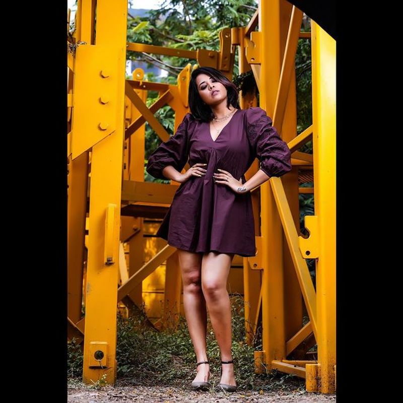 Anchor Anasuya stunning hot poses in short gown