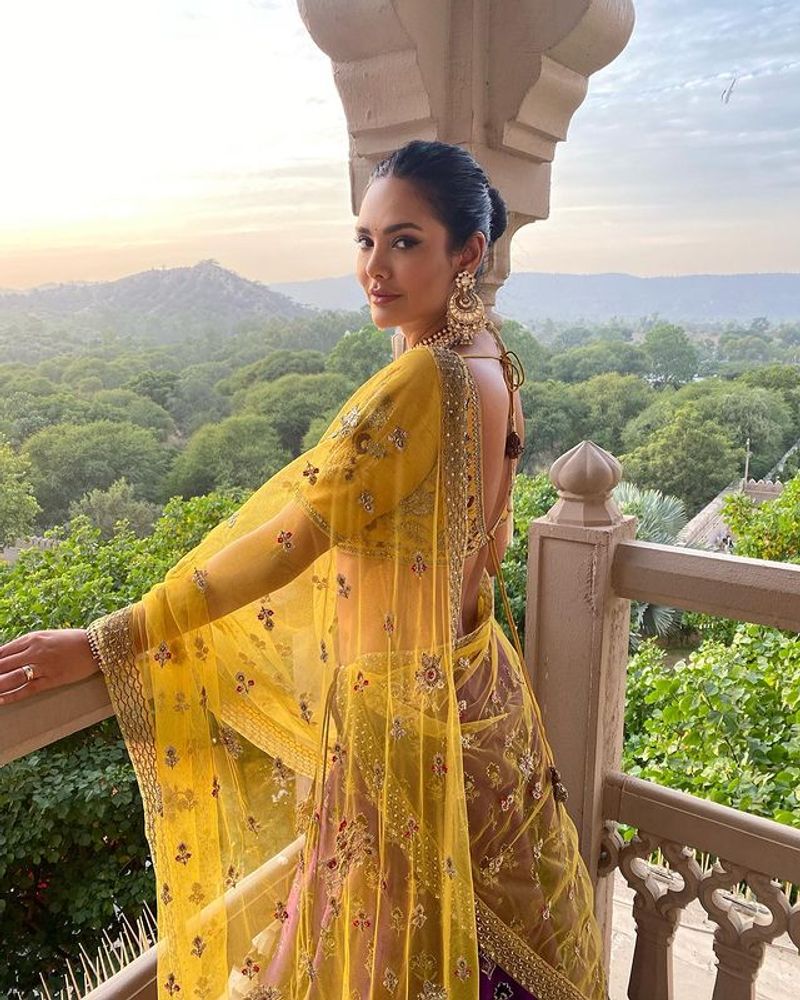 Esha Gupta stuns her fans in yellow half saree