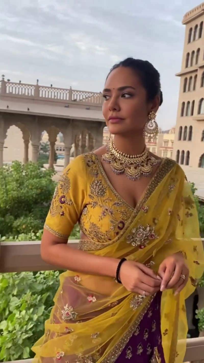 Esha Gupta stuns her fans in yellow half saree