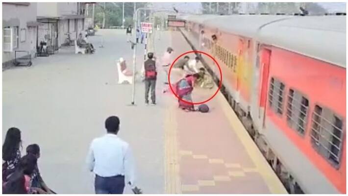 Hero Cop Saves Woman From Falling Under Train Hero Cop Saves Woman From Falling Under Train