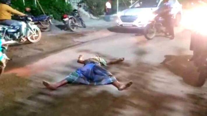 Drinking man torture for peoples and police he is stop the traffic and sleep on the road Drinking man torture for peoples and police he is stop the traffic and sleep on the road