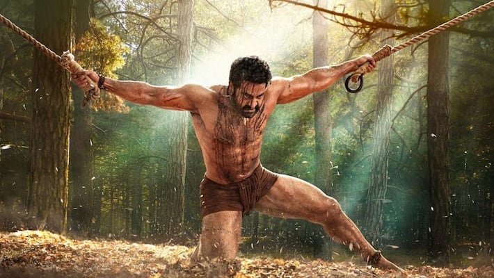 RRR latest poster: Jr NTR's flaunting his six-pack abs; fans are going gaga over his look as Bheem RCB RRR latest poster: Jr NTR's flaunting his six-pack abs; fans are going gaga over his look as Bheem RCB