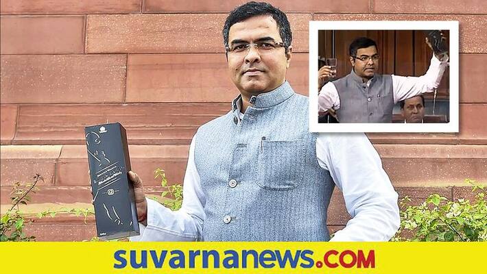 Delhi BJP MP brandishes liquor pack in Parliament akb Delhi BJP MP brandishes liquor pack in Parliament akb