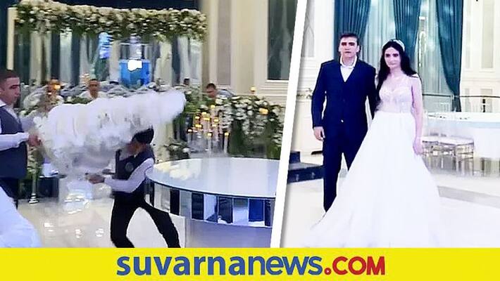 viral video Bride and groom shocked as hotel staff drops wedding cake akb viral video Bride and groom shocked as hotel staff drops wedding cake akb