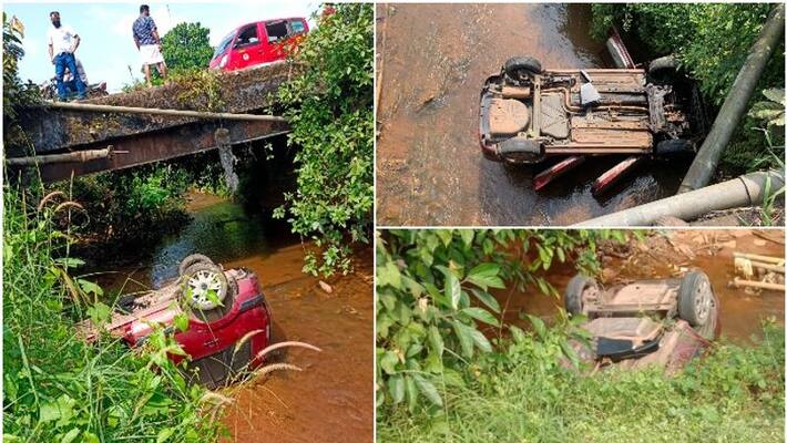 The car overturned from the bridge, passenger escaped The car overturned from the bridge, passenger escaped