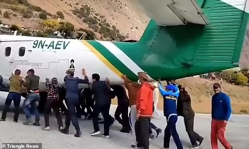 plane Tires bursts in Bajura Airport passengers push the plane away from the runway