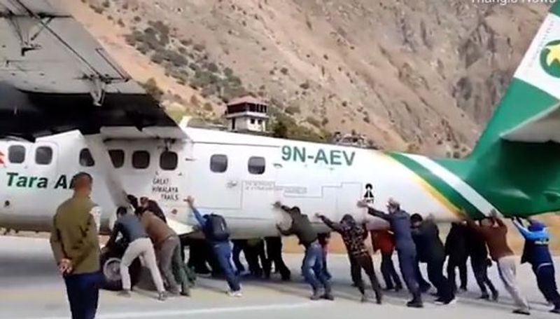 plane Tires bursts in Bajura Airport passengers push the plane away from the runway