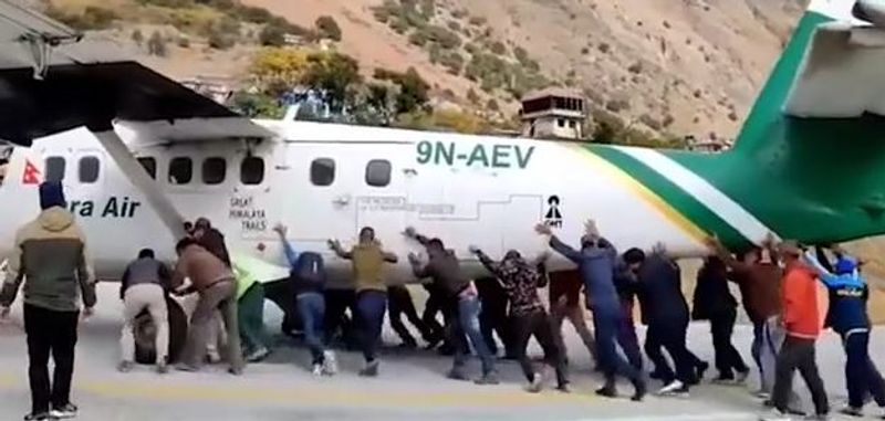 plane Tires bursts in Bajura Airport passengers push the plane away from the runway
