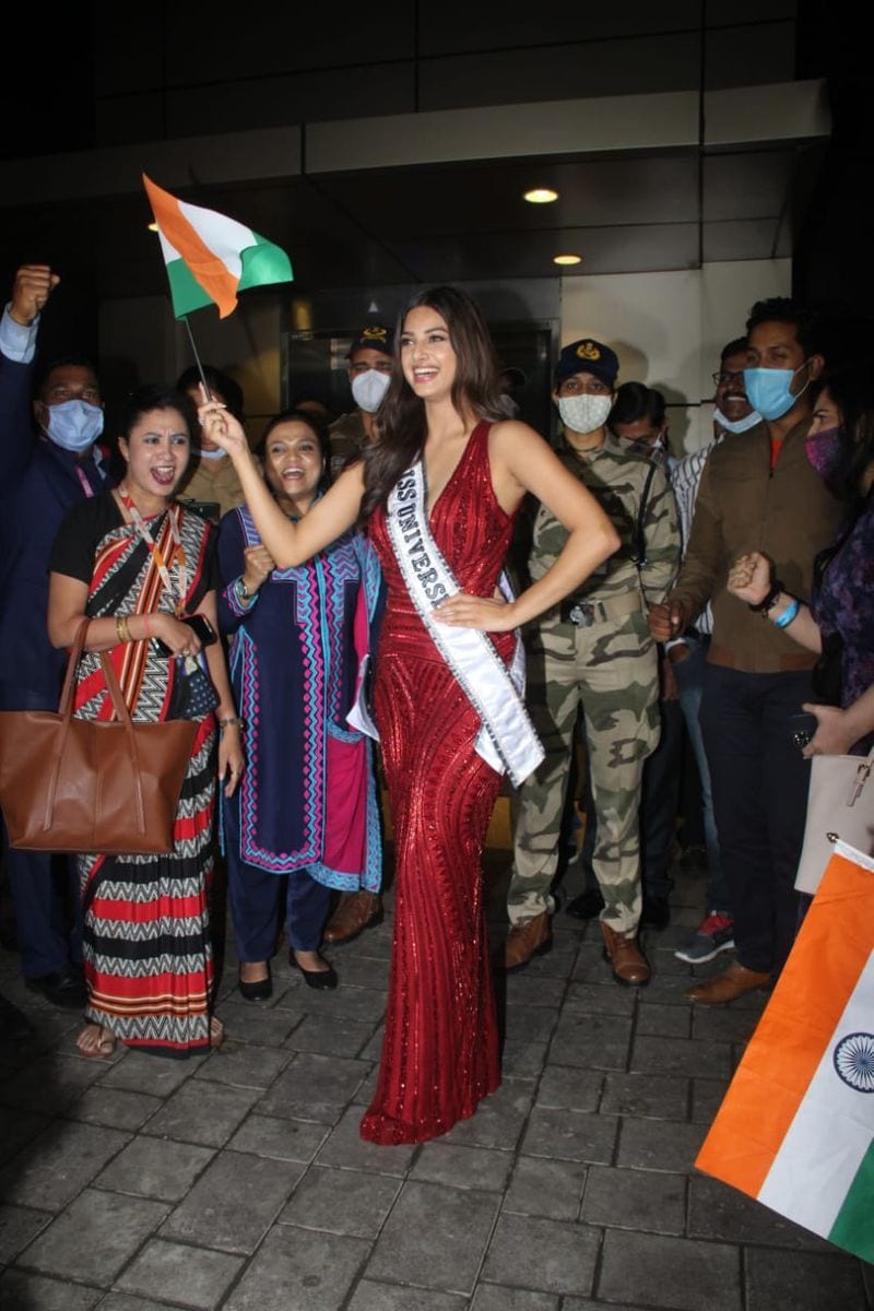Miss Universe 2021 Harnaaz Sandhu dons stunning red gown poses with Indian flag at Mumbai airport RCB