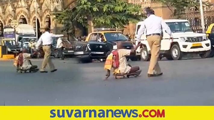 Internet Salutes Mumbai Traffic Cop for Helping Specially abled Man Cross Busy Road akb Internet Salutes Mumbai Traffic Cop for Helping Specially abled Man Cross Busy Road akb
