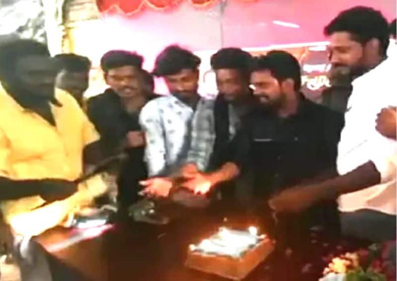 Vijay makkal iyakkam executive and vijay fans cutting a birthday cake with a sword in Madurai is currently going viral on social media