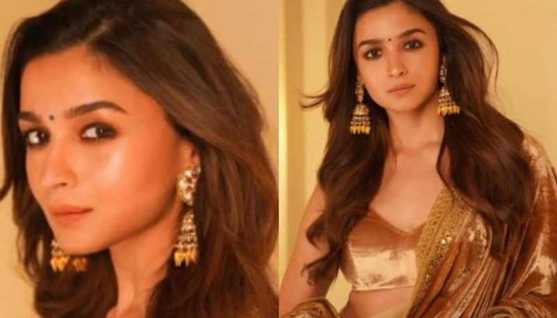 Golden girl Alia Bhatt looks in Sabyasachi lehenga