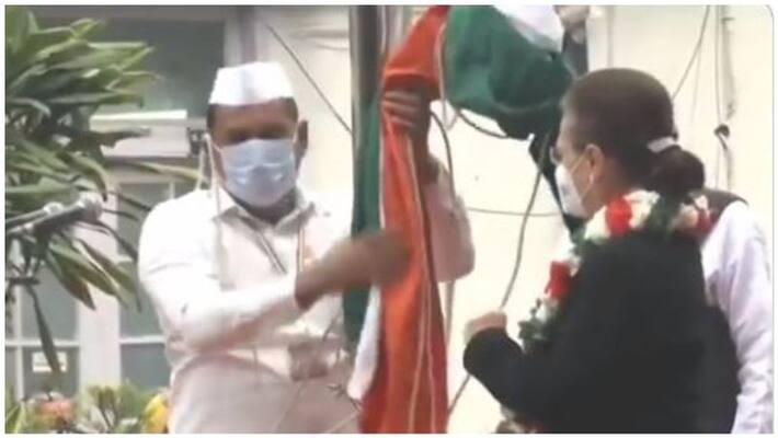 Congress flag falls off while being hoisted by party's interim president Sonia Gandhi on the party's 137th Foundation Day Congress flag falls off while being hoisted by party's interim president Sonia Gandhi on the party's 137th Foundation Day
