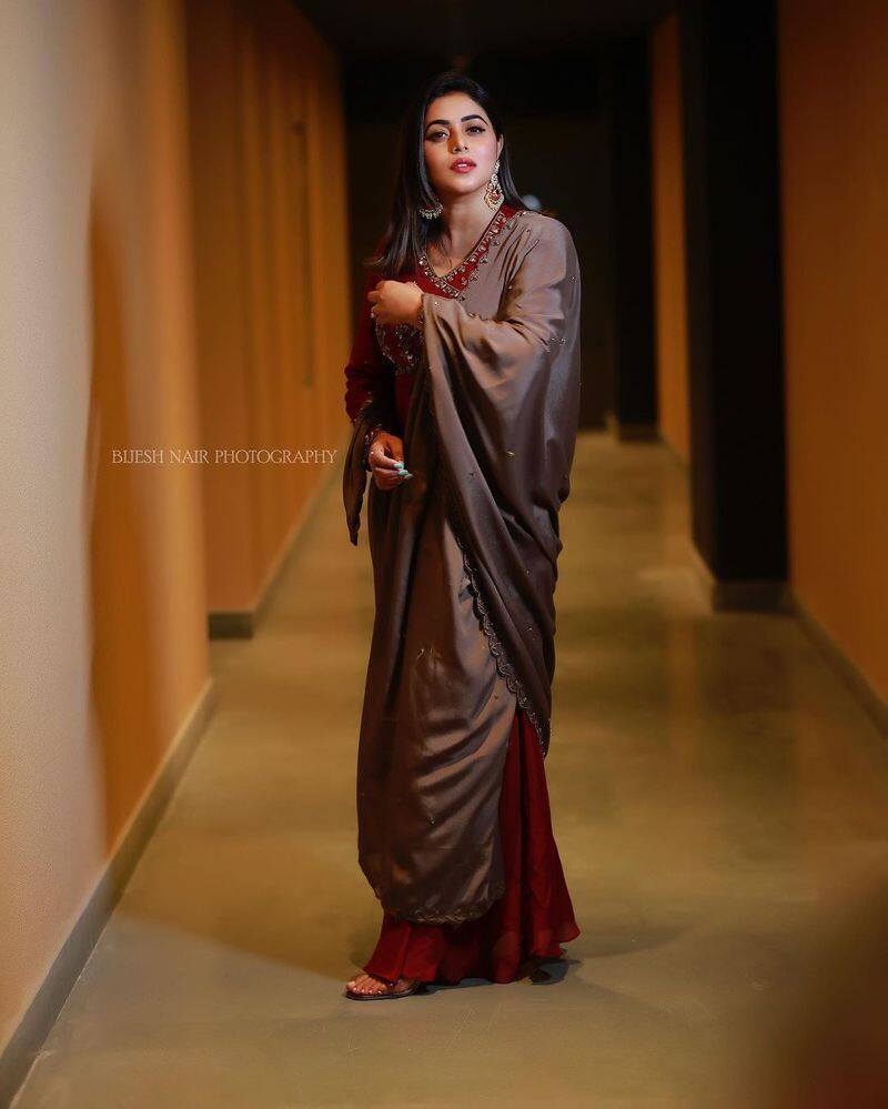 akhanda fame purna looks adorable in maroon color trendy wear