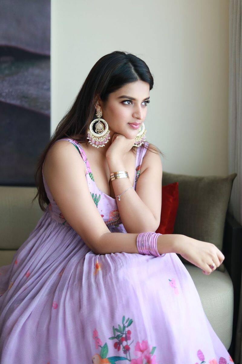 nidhhi agarwal mind block in pink gown cleavage show fans goes festival mood